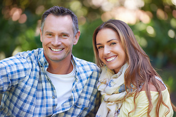 Image showing Just us, no distractions. Portrait of an affectionate couple sitting outside.