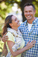 Image showing Her feelings for him are true. An affectionate couple outside on a summers day.