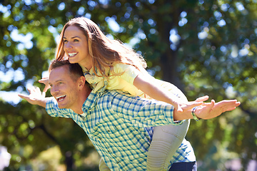 Image showing Playful in the summer sun. Shot of a playful couple enjoying the summer sun.