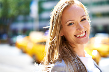 Image showing Concrete jungle jet setter. A cropped shot of a beautiful woman walking around the city in the day time.