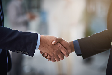 Image showing Partners in profit. Cropped shot of two businessmen shaking hands.