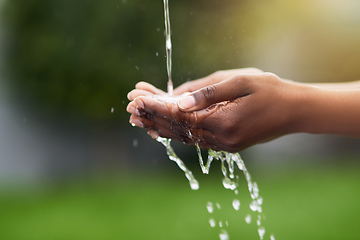 Image showing Water...the source of all life. Cropped shot of a woman washing her hands outdoors.