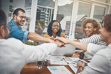 Image showing This is what good teams are made of. Shot of a group of businesspeople joining their hands together in unity.