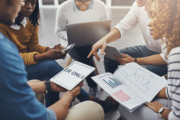 Image showing Social media is the key to success. High angle shot of unrecognizable colleagues having a meeting in the office.