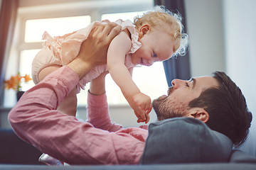 Image showing Nothing makes me happier than being your dad. Shot of a young man spending quality time with his adorable daughter at home.