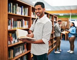 Image showing Put in the hard work for the good of your future. Portrait of a university student reading a book in the library at campus.