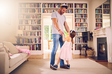 Image showing Filling her childhood with endless fun. Shot of a father bonding with his little daughter at home.