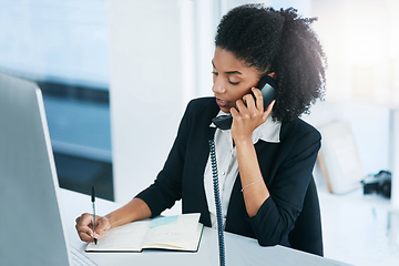 Image showing Im calling to confirm our meeting for tomorrow.... Shot of a young businesswoman talking on a telephone in an office.