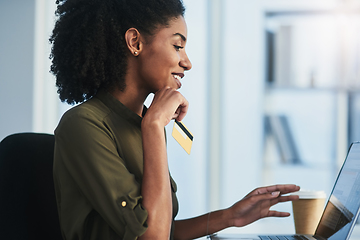 Image showing Online shopping made easier just for you. Shot of a young businesswoman using her laptop and credit card in a modern office.