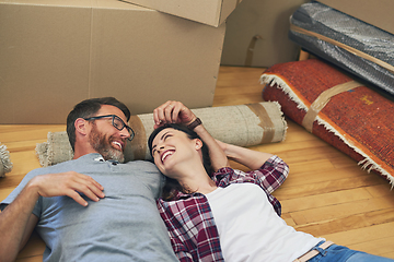 Image showing We did it my love. Shot of a happy couple relaxing together in their home on moving day.