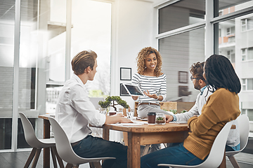 Image showing Its time to flex your problem-solving muscles. Shot of a group of businesspeople having a meeting in an office.