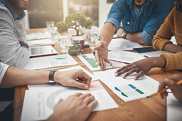 Image showing Getting to the root in a timely manner. Shot of a group of businesspeople discussing statistics.