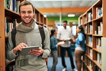 Image showing I work hard and smart. Portrait of a university student using a digital tablet in the library at campus.