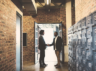 Image showing I look forward to working with you. Shot of two professional businessmen shaking hands outside their office.