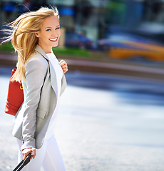 Image showing Have you found your inner jet setter. A portrait of a gorgeous woman with her luggage in New York.