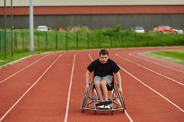 Image showing A person with disability in a wheelchair training tirelessly on the track in preparation for the Paralympic Games