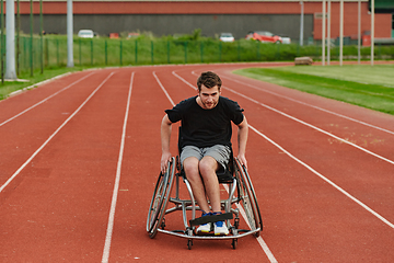 Image showing A person with disability in a wheelchair training tirelessly on the track in preparation for the Paralympic Games