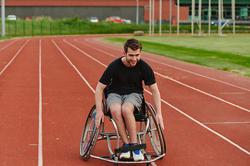 Image showing A person with disability in a wheelchair training tirelessly on the track in preparation for the Paralympic Games