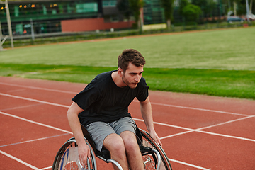 Image showing A person with disability in a wheelchair training tirelessly on the track in preparation for the Paralympic Games