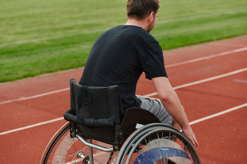 Image showing A person with disability in a wheelchair training tirelessly on the track in preparation for the Paralympic Games