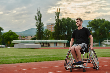 Image showing A person with disability in a wheelchair training tirelessly on the track in preparation for the Paralympic Games