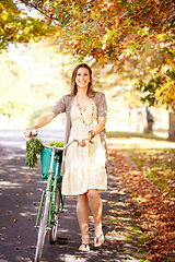 Image showing Autumn beauty. Shot of an attractive young woman in the park on an autumn day.