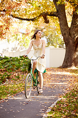 Image showing Autumn beauty. Shot of an attractive young woman in the park on an autumn day.