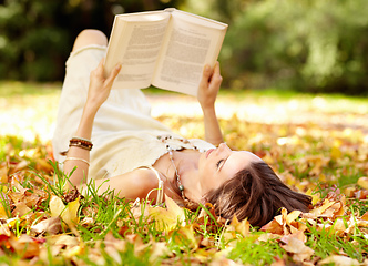 Image showing Autumn beauty. Shot of an attractive young woman in the park on an autumn day.