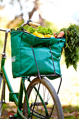 Image showing Packed with goodness. Cropped shot of a bag of vegatables on a bike.