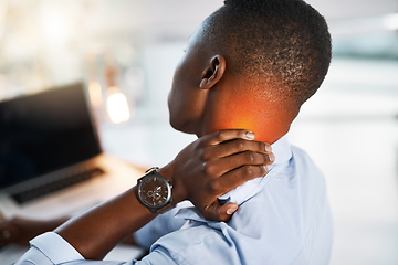 Image showing I think its time I called it a day. Shot of a young unrecognizable businessman suffering from neck pain while trying to work in the office.