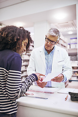 Image showing So I only take these twice a day. Shot of a dedicated mature male pharmacist giving a customer prescription meds over the counter.