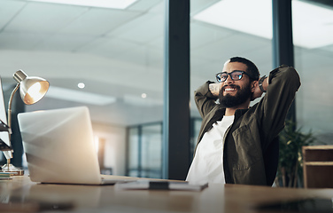 Image showing I gave it my all, I got it all. Shot of a young businessman taking a break while working late at night in a modern office.