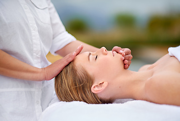 Image showing Simply blissful. Cropped shot of a young woman enjyoing a massage at the day spa.