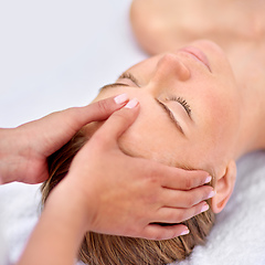 Image showing Shes leaving her troubles behind. Cropped shot of a young woman enjyoing a massage at the day spa.