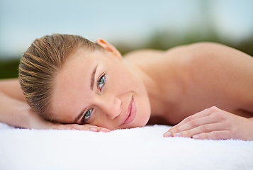 Image showing Spending some quality time with myself. Cropped portrait of a young woman lying on a massage table.