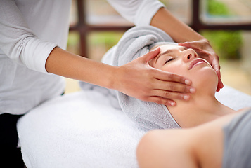 Image showing Getting rid of all the tension. Cropped shot of a young woman enjyoing a massage at the day spa.