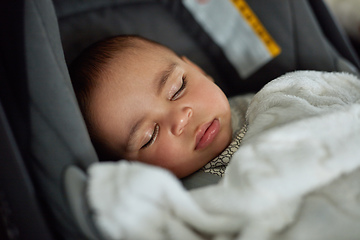 Image showing This car trip is going to be a dream. Shot of an adorable baby boy sleeping in a car seat.