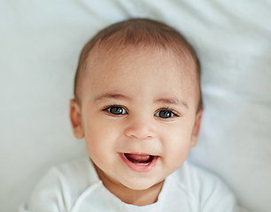 Image showing Cute doesnt get any cuter than this. Shot of an adorable baby boy at home.