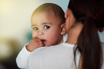 Image showing Hold my calls until Im done bonding with Mom. Shot of a loving mother carrying her baby boy at home.