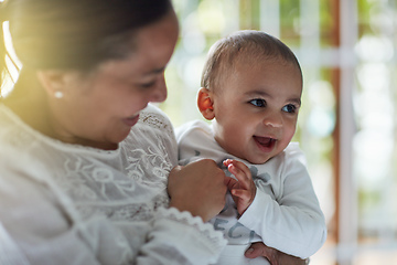 Image showing Mommys lil love bug. Shot of an adorable baby boy bonding with his mother at home.