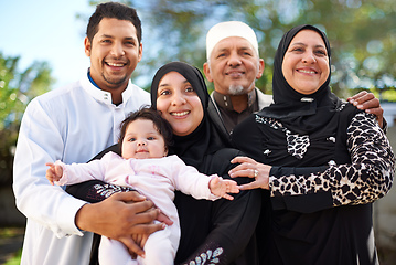 Image showing One big happy family. A muslim family enjoying a day outside.