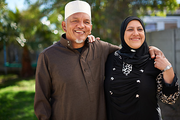 Image showing Living life with love. Portrait of a smiling senior muslim couple outside.