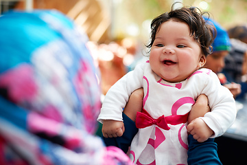 Image showing Whos my pretty girl. Shot of a muslim mother and her little baby girl.