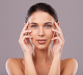 Image showing Gorgeous in every way. Beauty shot of a beautiful young woman with perfect skin against a gray background.