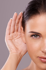 Image showing Taking your beauty advice. Beauty shot of a young woman with a cupped hand behind her ear.