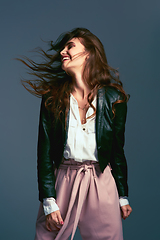 Image showing I dont let society dress me, I follow my own rules. Studio shot of an attractive young fashionable woman posing against a blue background.