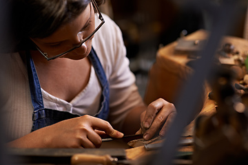 Image showing Crafted with care. An artist creating something out of wood.