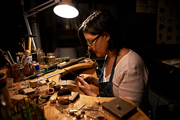 Image showing My creation station. An artist creating something out of wood.