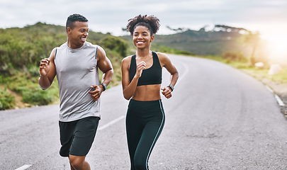 Image showing The healthier you are, the happier you feel. Shot of a sporty young couple exercising together outdoors.