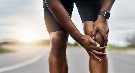 Image showing This doesnt feel right. Closeup shot of a sporty man suffering with knee pain while exercising outdoors.